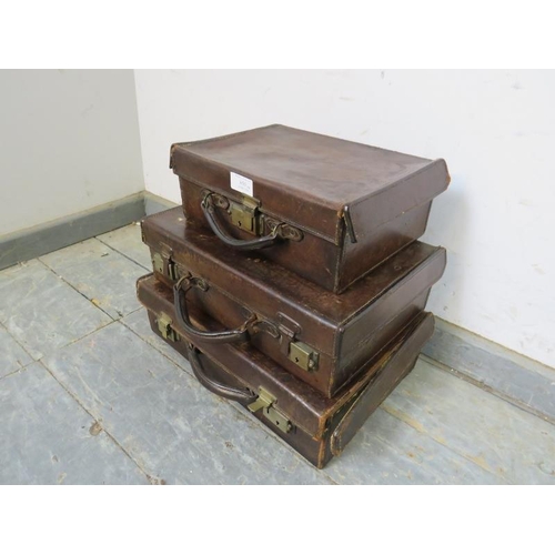 850 - Three graduated antique leather luggage cases of good patina, with brass fittings. 
Largest H11cm W4... 