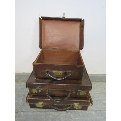 850 - Three graduated antique leather luggage cases of good patina, with brass fittings. 
Largest H11cm W4... 