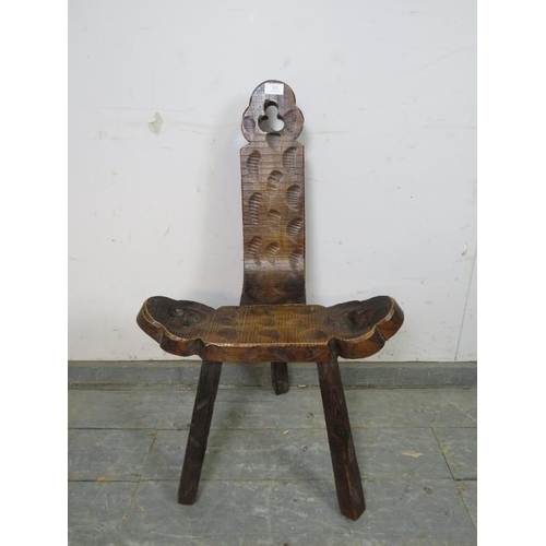 852 - An unusual vintage Spanish Brutalist carved wooden chair, having pierced trefoil decoration, on trip... 