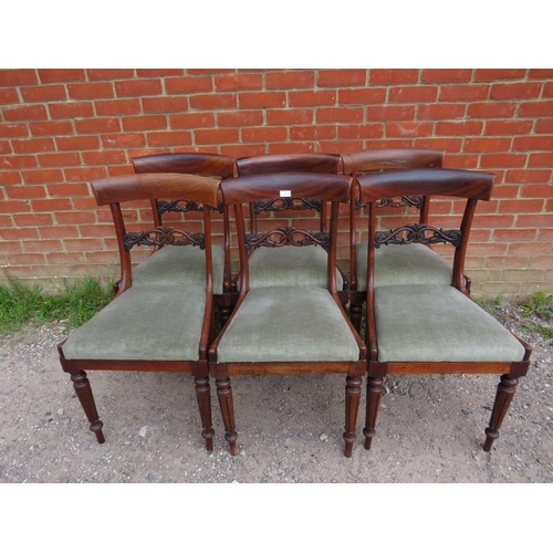 855 - A set of six Victorian rosewood dining chairs, having ornately carved and pierced backs, above drop ... 