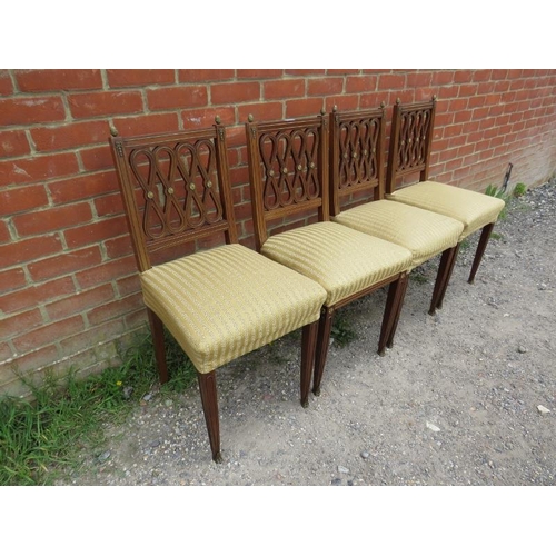 858 - A set of four antique mahogany Regency Revival dining chairs, having gilt brass mounts, upholstered ... 