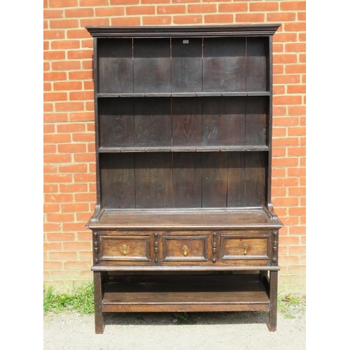 861 - A 19th century oak kitchen dresser in a 17th century taste, the moulded cornice above two open shelv... 