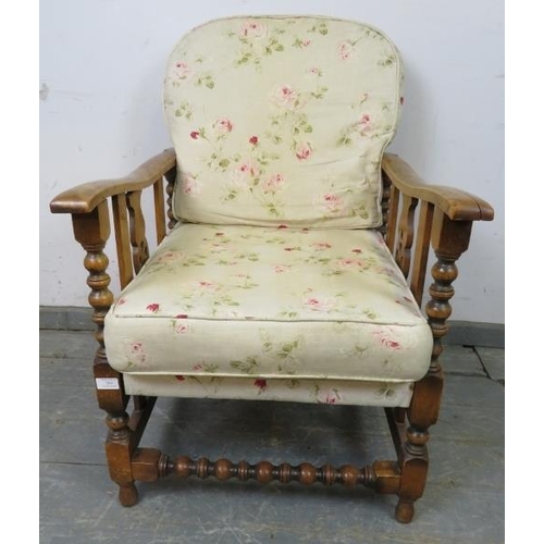 866 - An antique Continental beech and ash wheelback reclining armchair, having carved and pierced sides a... 