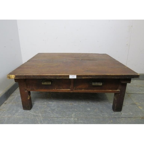 869 - A vintage Japanese fruitwood low coffee table, housing two short drawers with brass scalloped handle... 