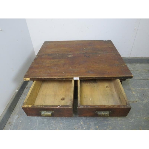 869 - A vintage Japanese fruitwood low coffee table, housing two short drawers with brass scalloped handle... 