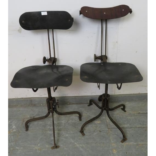 871 - A pair of early 20th century height-adjustable machinist’s stools, also having height-adjustable bac... 