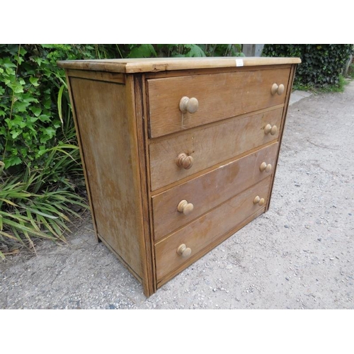 876 - An antique light oak shaker style chest housing four long drawers with turned wooden knob handles.
H... 