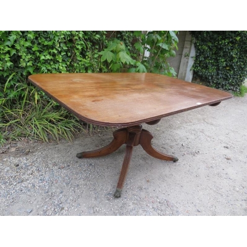 877 - A Regency Period mahogany tilt-top breakfast table, the rectangular top with reeded edge, on a turne... 