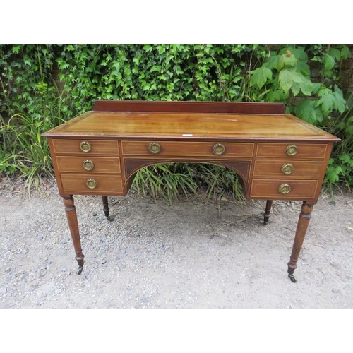 878 - A 19th century mahogany kneehole desk, crossbanded and strung with satinwood, housing a configuratio... 