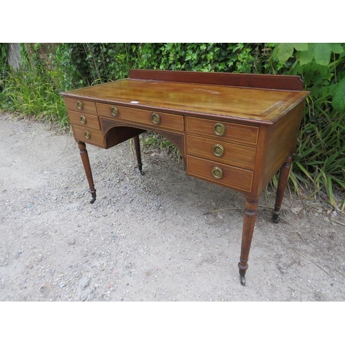 878 - A 19th century mahogany kneehole desk, crossbanded and strung with satinwood, housing a configuratio... 