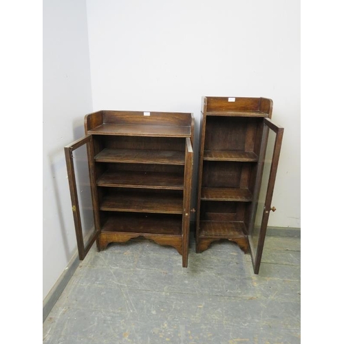 881 - Two vintage oak glazed bookcases, with ¾ galleries, housing two and three shelves respectively, on b... 