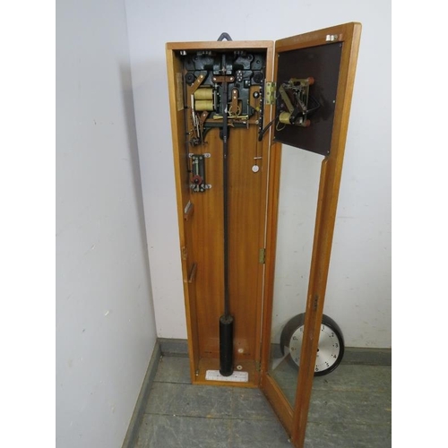 884 - A vintage beech cased electric wall clock set by Gent of Leicester, comprising a master clock with p... 