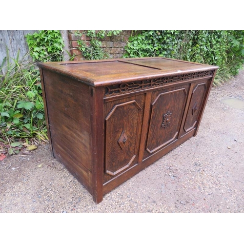 885 - A large antique oak and pitch pine panelled coffer in the 17th century taste, the front with blind f... 