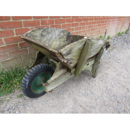 892 - A weathered antique oak garden wheelbarrow/garden planter. 
H58cm W140cm D66cm (approx).
Condition r... 