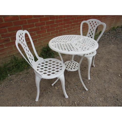 896 - A vintage cast iron 3-piece garden set painted white, comprising a circular two-tier table with latt... 