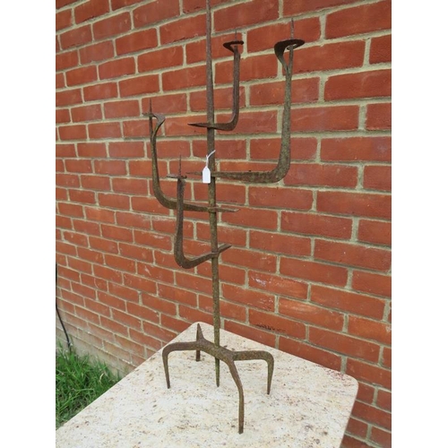 899 - An antique artisan made wrought iron candelabra in the Gothic taste, on spider legs. 
H98cm W38cm D2... 