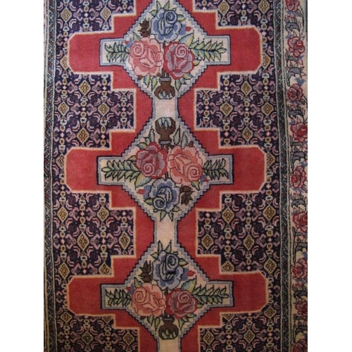 910 - North West Persian Senneh runner 10 central interlocking motifs depicting roses on a pink ground 383... 