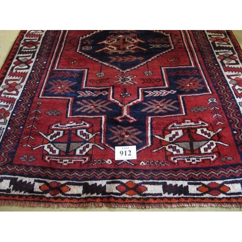 912 - South West Persian Lori rug.  Central six sided motif, blue on mellow red ground, geometric pattern ... 