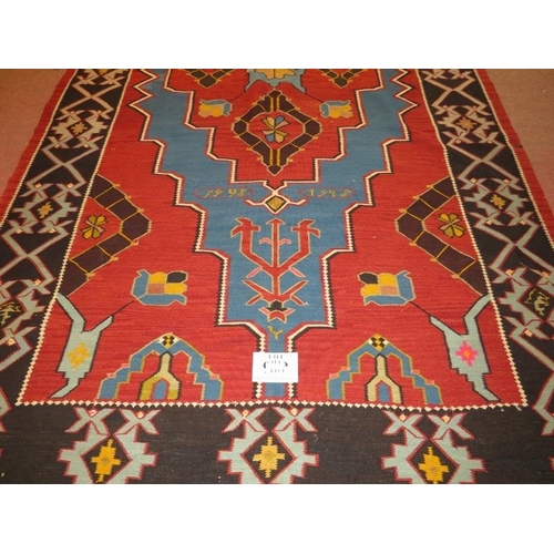 913 - A large 20th century Armenian Kilim rug, vibrant colours, blue on burnt amber field. 340cm x 161cm (... 