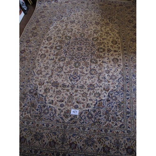 917 - A fine central Persian Kashan carpet.  A 16 point central motif on cream ground, surrounded by flowe... 