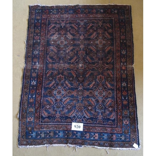 920 - A 19 Century Persian rug. Blue on burnt amber ground 147 x 112cms

Condition report: Some age relate... 