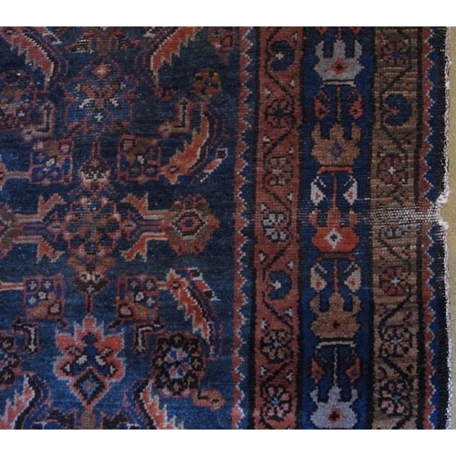 920 - A 19 Century Persian rug. Blue on burnt amber ground 147 x 112cms

Condition report: Some age relate... 