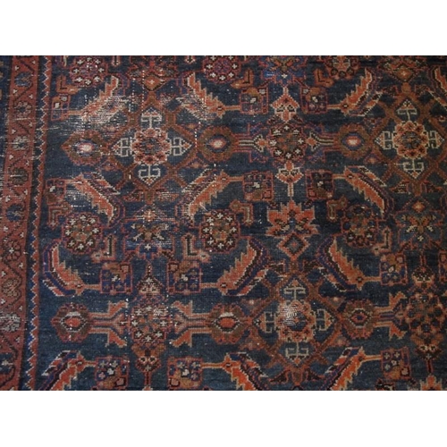 920 - A 19 Century Persian rug. Blue on burnt amber ground 147 x 112cms

Condition report: Some age relate... 