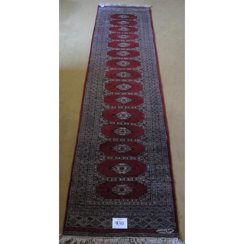 930 - Mid - late 20th Century Indian runner, 15 central panels on red ground 305 x 79cms.

Condition repor... 