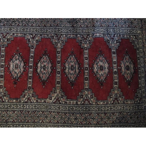 930 - Mid - late 20th Century Indian runner, 15 central panels on red ground 305 x 79cms.

Condition repor... 