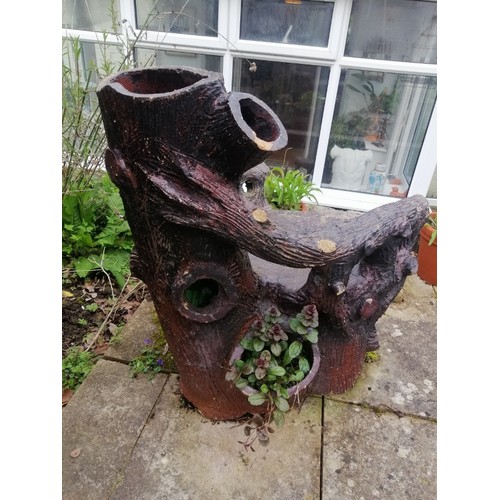 887 - A large 19th century naturalistic stoneware garden seat, modelled as a tree stump with backrest in t... 