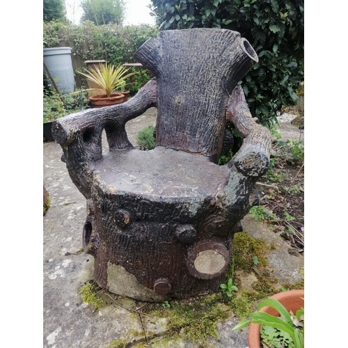 887 - A large 19th century naturalistic stoneware garden seat, modelled as a tree stump with backrest in t... 