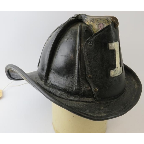 1 - A 1950s US Fire Department (No 1) leather beaver tail helmet with Cairns & Brother label