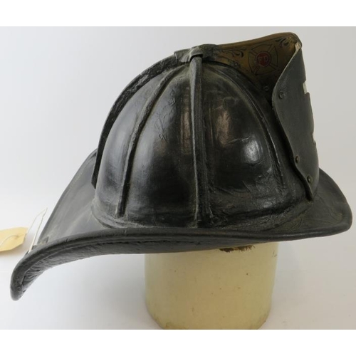 1 - A 1950s US Fire Department (No 1) leather beaver tail helmet with Cairns & Brother label