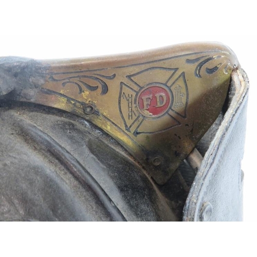 1 - A 1950s US Fire Department (No 1) leather beaver tail helmet with Cairns & Brother label