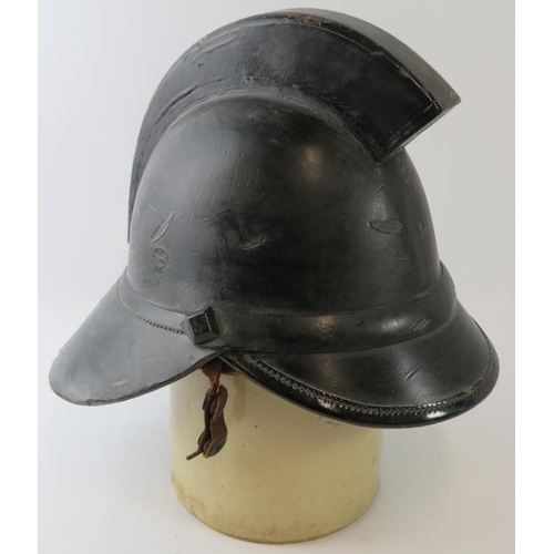 10 - A 1920s British leather Hendry fire helmet with square comb