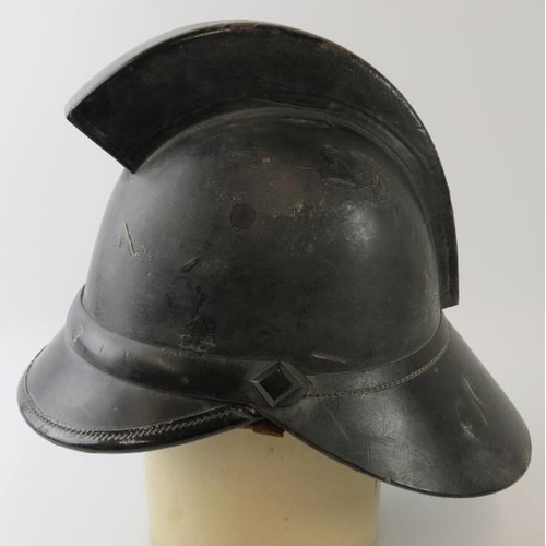 10 - A 1920s British leather Hendry fire helmet with square comb