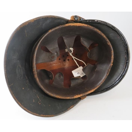 10 - A 1920s British leather Hendry fire helmet with square comb