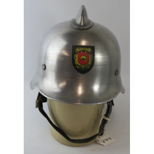 14 - A 1980s Dutch Fire Service polished steel fire helmet with leather neck cowl.