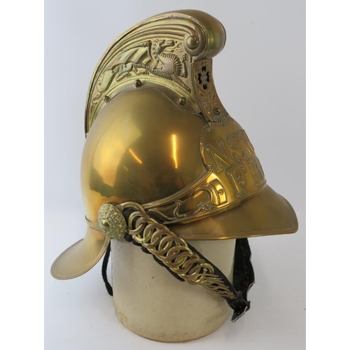 17 - An Australian New South Wales Fire Service replica brass fire helmet with chain link chin strap, cir... 