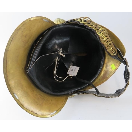 17 - An Australian New South Wales Fire Service replica brass fire helmet with chain link chin strap, cir... 