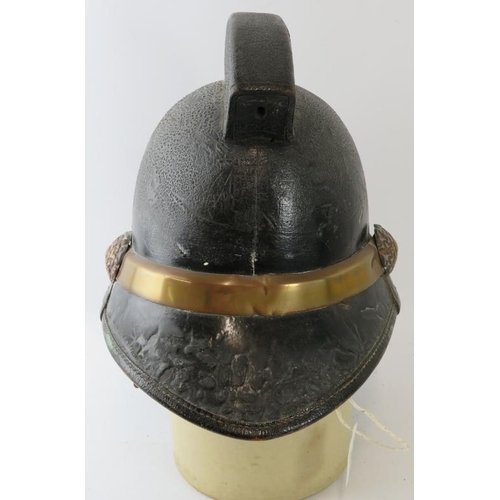 19 - A British 1950s Hendry brass mounted fire helmet with square comb.