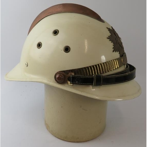 22 - A 1970s Brazilian Fire Service white fire helmet with brass mounts.