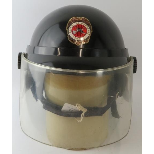 23 - A 1980s Panama Fire Service black ABS fire helmet with visor