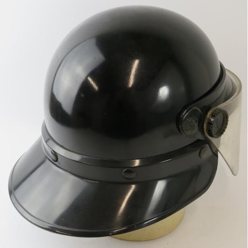 23 - A 1980s Panama Fire Service black ABS fire helmet with visor