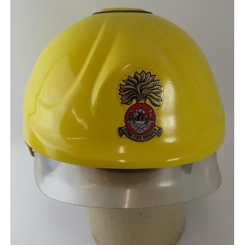 28 - A 1990s Irish Cork Fire Brigade integrated visor fire helmet