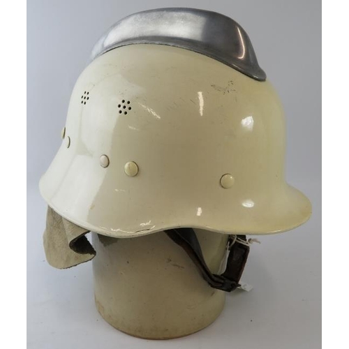 3 - A 1980s Dutch Fire Service white steel fire helmet with polished metal comb and leather neck cowl.