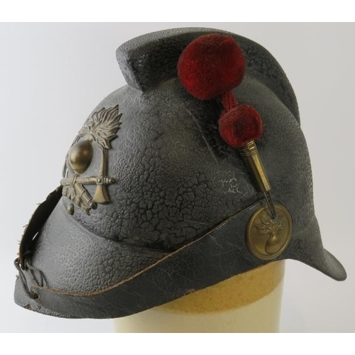 33 - A rare early 20th century Argentine felt fire helmet with red felt side plume, circa 1910