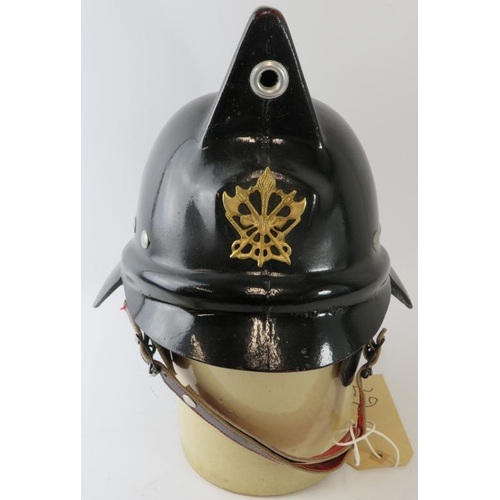 37 - A 1980s Mexican Mexico City Fire Service fire helmet with brass badge .