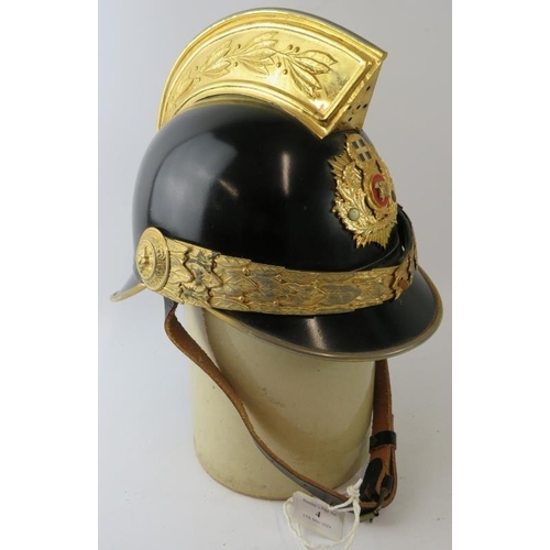 4 - A Greek Athens Fire Brigade black steel fire helmet with brass mounts and badge