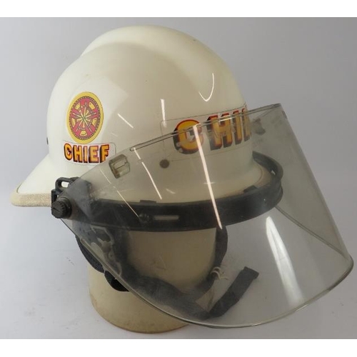 44 - A 1970s American US Fire Department white Fire Chief's helmet with visor.